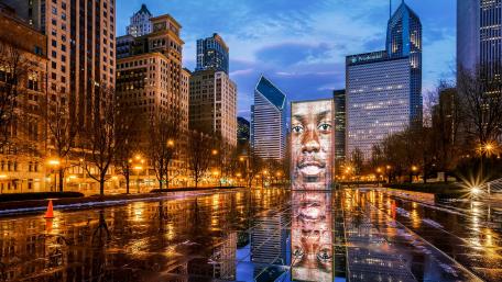 Chicago skyline reflecting in serene water at dusk wallpaper