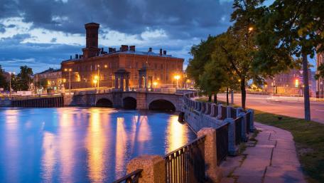 Evening Glow over the Riverside Townscape wallpaper