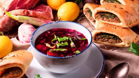 Delicious Borscht Surrounded by Traditional Polish Delicacies wallpaper