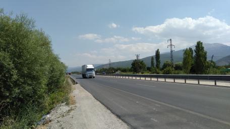 Majestic Truck on Open Road Under Blue Skies wallpaper