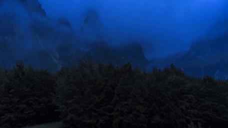 Mysterious Mountains Shrouded in Misty Clouds wallpaper