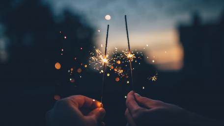 Hands with sparklers wallpaper