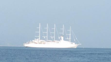 Majestic Sail Yacht on Tranquil Waters wallpaper