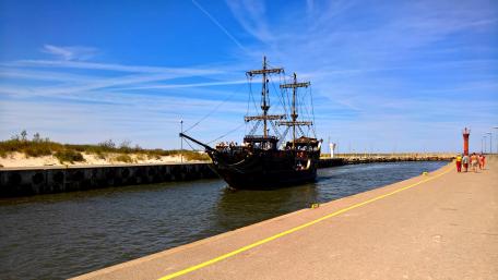 Mystical Ship Sailing in Poland's Serene Waters wallpaper