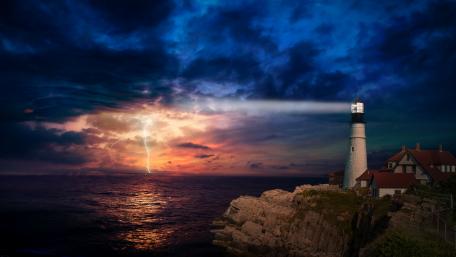 Lightning on the horizon at Portland Head Light wallpaper