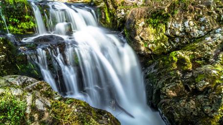 Waterfall in boulders wallpaper