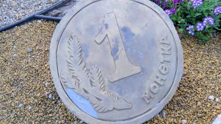 Giant Coin on Gravel Ground wallpaper