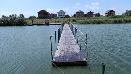 Serene Waterway Pathway Over Tranquil Waters wallpaper