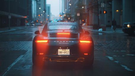 Grey Porsche car on road wallpaper