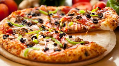 Deliciously Cheesy Pizza Slice Wallpaper wallpaper