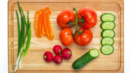 Fresh Vibrant Vegetables on a Wooden Cutting Board wallpaper
