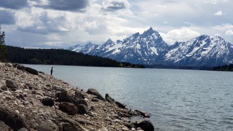 Fisherman by the mountains wallpaper