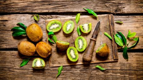 Fresh Kiwi on Wooden Planks for a Rustic Touch wallpaper