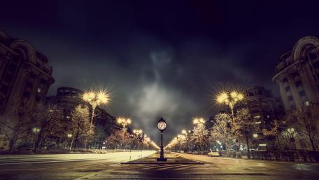 Bucharest street clock by night wallpaper