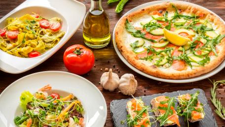 Delicious Italian Feast with Pizza and Pasta wallpaper
