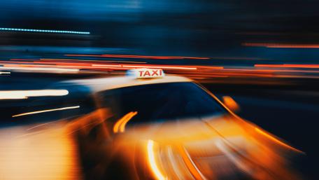 Dynamic Motion of a Yellow Taxi at Night wallpaper