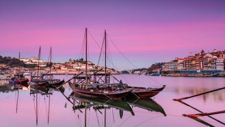 Serene Sunset Over Tranquil City Harbor wallpaper