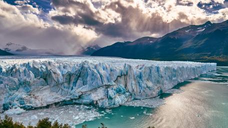 Majestic Glacier Under Dramatic Skies wallpaper