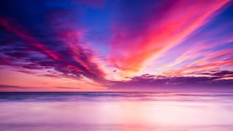 Sunset Over Tranquil Ocean Waves wallpaper