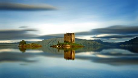 Serenity of a Castled Isle Amidst Tranquil Waters wallpaper