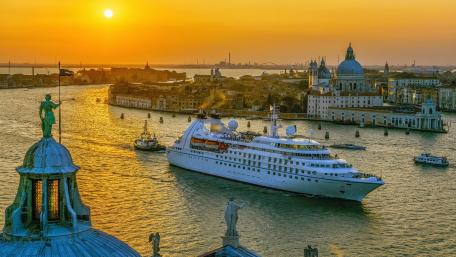 Golden Sunset Over City and Waterway Scene wallpaper