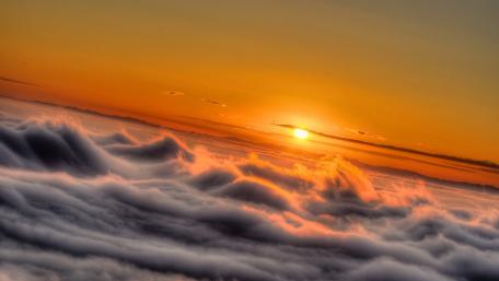 Serene Sunrise Above the Clouds wallpaper