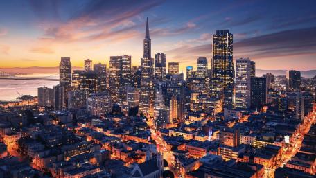 Stunning Sunset Over a Metropolis Skyline wallpaper
