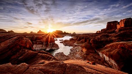 Majestic Sunrise Over Badlands River Landscape wallpaper