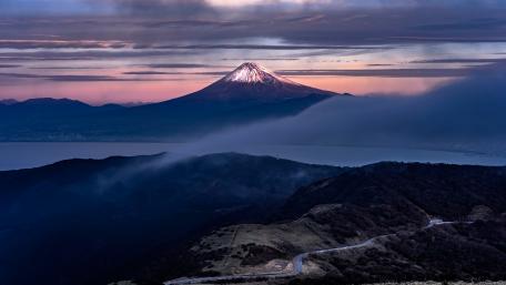 Snow-Capped Majesty of the Volcano at Dusk wallpaper
