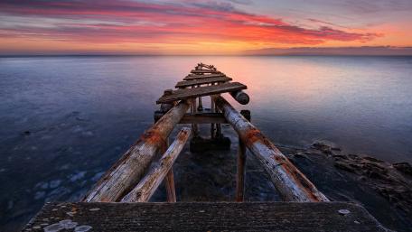 Tranquil Sunset at Abandoned Pier wallpaper