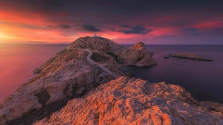Stunning Corsica Sunset Over Rocky Coastline wallpaper