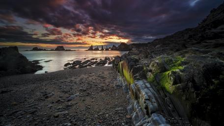 Serene Twilight Over Coastal Rocks wallpaper