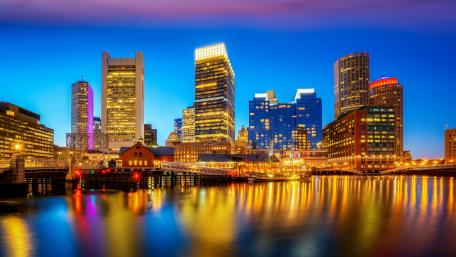 Vibrant City Lights Reflecting on Water at Dusk wallpaper