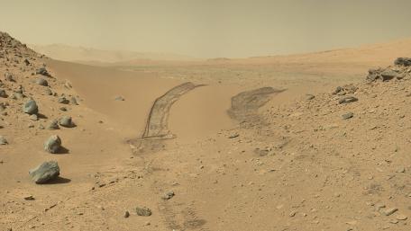 Exploring the Mars Landscape with Rover Tracks wallpaper