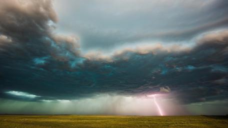 Lightning Strikes Over Stormy Meadow wallpaper