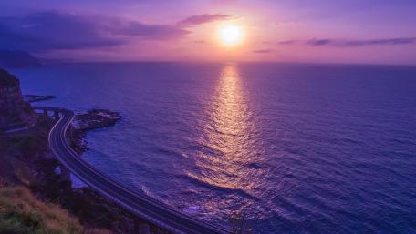 Sunset Over Serene Sea Highway wallpaper