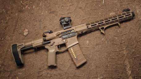 Modern Tactical Rifle on Rough Terrain wallpaper