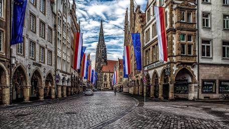 Charming Historic Street in a Vibrant Cityscape wallpaper