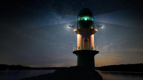 Lighthouse Under Starry Night Sky wallpaper