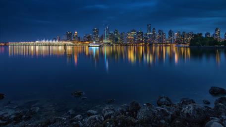 Skyline Serenity Reflected on Calm Waters wallpaper