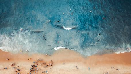 Aerial View of a Bustling Beach Scene wallpaper