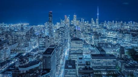 Gleaming Metropolis Under Starlit Skies wallpaper