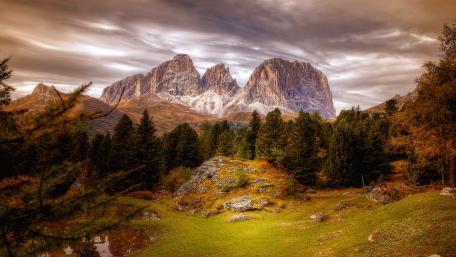Majestic Mountains Beneath a Dramatic Sky wallpaper