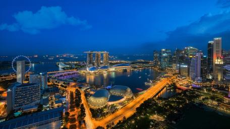 Stunning Night View of a Vibrant Cityscape with Marina Bay Waterside wallpaper