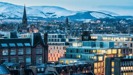 Snowy Cityscape with Modern Architecture at Dusk wallpaper