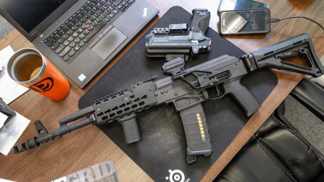 Tactical Gear and Weapon on Desk wallpaper