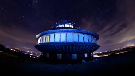 Futuristic Building Under Starry Sky wallpaper