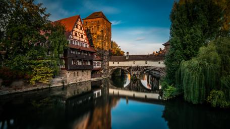 Historic Cityscape by the River in 4K Quality wallpaper