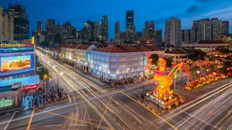 Vibrant Cityscape at Dusk with Festive Lights wallpaper