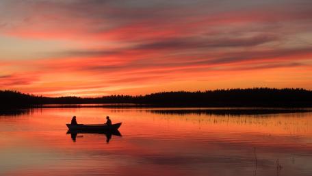 Tranquil Boat Ride at Sunset wallpaper